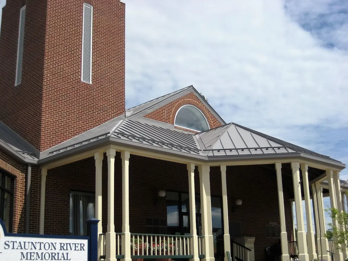 Skilled roofing craftsmen working on a residential roof in Shelby